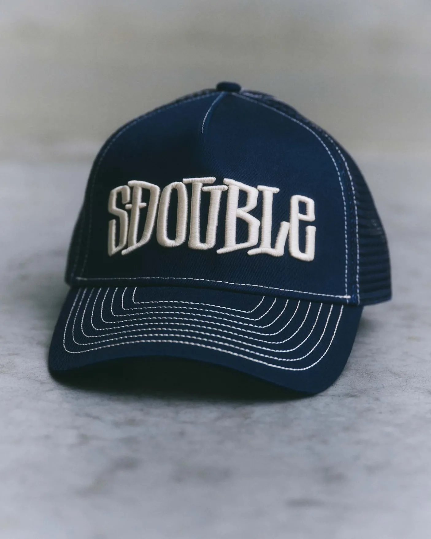 Mid-Block Curved Peak Trucker Cap
